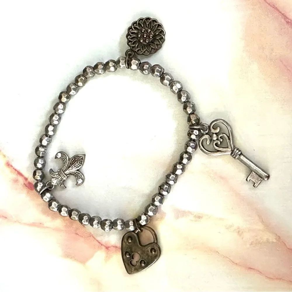 Silver/brass tone charm stretchy bracelet